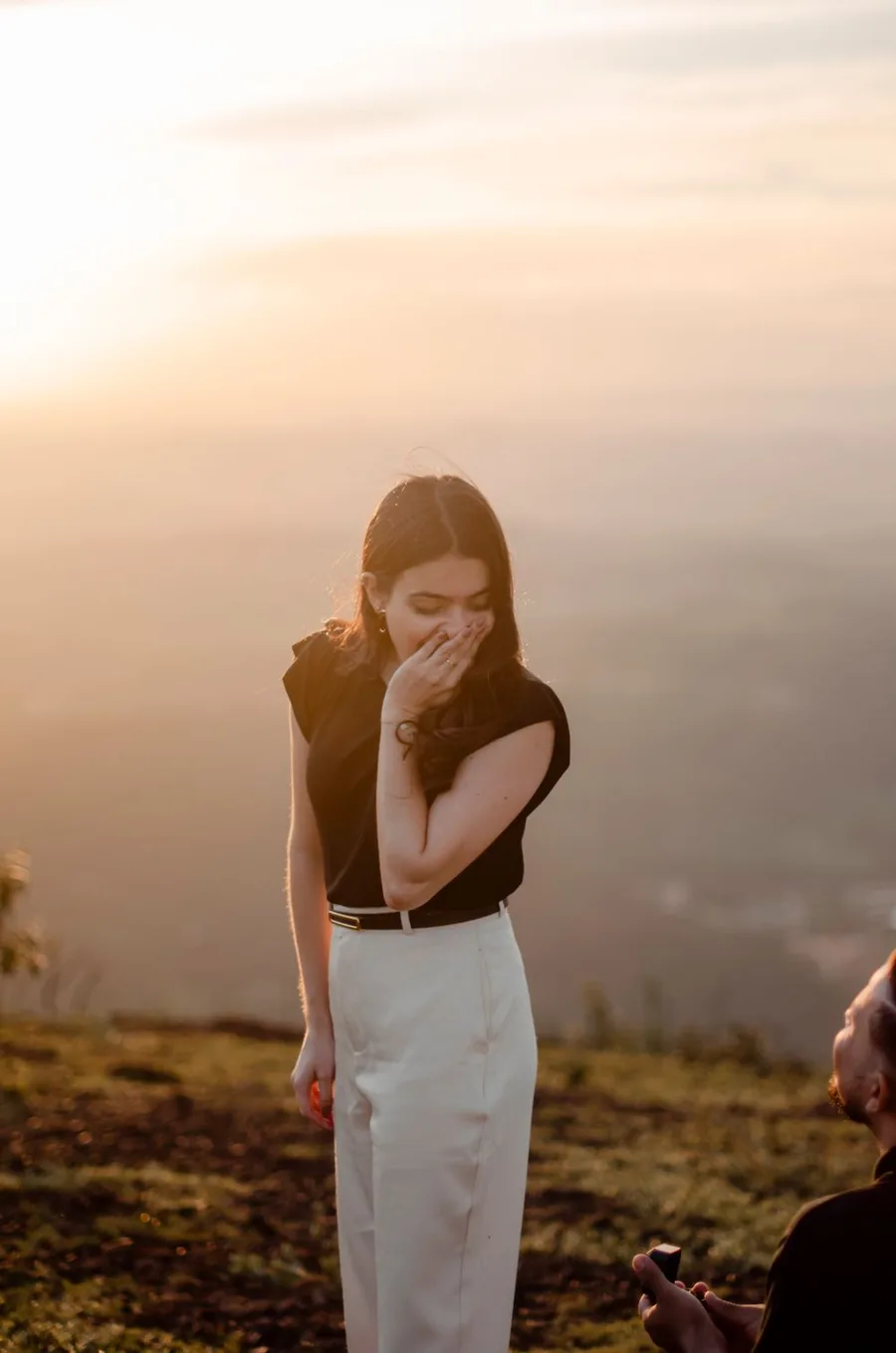 A surprise marriage proposal at sunset on a hilltop — she said yes